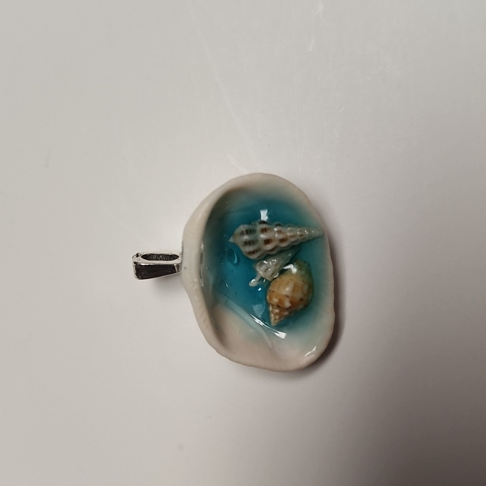 Handmade seashell beach scene necklace. Real seashell with blue resin 'o…
